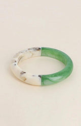 Aqua green and marbled ivory resin bangle with a bold two-tone design, glossy finish and sculptural rounded shape – Volange Paris, Parisian fashion in Sydney (Mosman, Paddington and Bronte) or Australia-wide online.