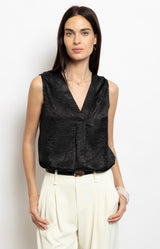 Black textured sleeveless V-neck top with subtle sheen – Parisian elegance French fashion by Volange Paris.