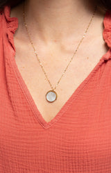 Gold-tone necklace with a luminous mother-of-pearl pendant and delicate textured chain, water-resistant and non-tarnish – Volange Paris, Parisian fashion in Sydney (Mosman, Paddington and Bronte) or Australia-wide online.