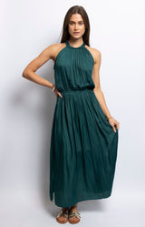 Green halter-neck maxi dress with pleated bodice and flowy skirt – Modern French style by Volange Paris.