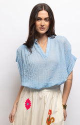 Light blue cotton blouse with a relaxed oversized fit, flattering V-neckline and airy cotton voile fabric – Volange Paris, Parisian fashion in Sydney (Mosman, Paddington and Bronte) or Australia-wide online.