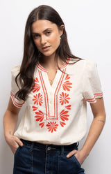 Soft ivory blouse in 100% cotton with coral-red floral embroidery, contrast stitching and a relaxed straight fit – Volange Paris, Parisian fashion in Sydney (Mosman, Paddington and Bronte) or Australia-wide online.
