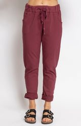Burgundy relaxed pants with metallic star detail – Parisian elegance by Volange Paris, French fashion in Sydney.
