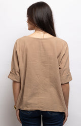 Sand colour linen cotton top with a relaxed oversized fit, soft boat neckline and rolled sleeves for effortless everyday style – Volange Paris, Parisian fashion in Sydney (Mosman, Paddington and Bronte) or Australia-wide online.