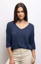 Navy lightweight knit top with a flattering V-neck, batwing sleeves and relaxed draped fit in a soft modal blend – Volange Paris, Parisian fashion in Sydney (Mosman, Paddington and Bronte) or Australia-wide online.