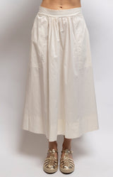 Off White cotton midi skirt with a full A-line silhouette, gathered waist, elasticated back and side pockets – Volange Paris, Parisian fashion in Sydney (Mosman, Paddington and Bronte) or Australia-wide online.