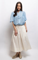 Off White cotton midi skirt with a full A-line silhouette, gathered waist, elasticated back and side pockets – Volange Paris, Parisian fashion in Sydney (Mosman, Paddington and Bronte) or Australia-wide online.