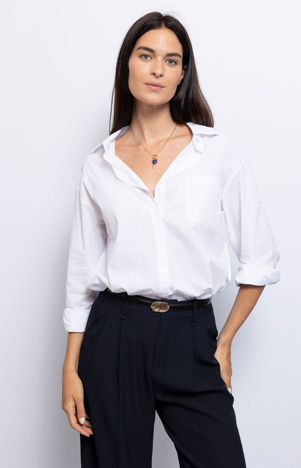 Classic white shirt with a crisp, tailored fit, ideal for versatile French elegance – Volange Paris.