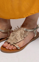 Beige and gold flat sandals with statement fringe detailing, metallic straps and an adjustable ankle strap – Volange Paris, Parisian fashion in Sydney (Mosman, Paddington and Bronte) or Australia-wide online.