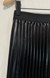 Black pleated midi skirt with soft satin finish and elegant flow, Parisian elegance by Volange Paris, French fashion in Sydney