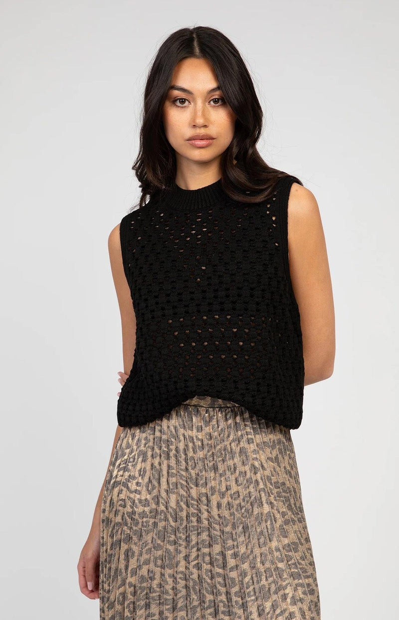 Black sleeveless mesh knit top with ribbed neckline and relaxed fit – French fashion by Volange Paris.