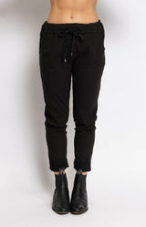 Black relaxed pants with metallic star detail – Parisian elegance by Volange Paris, French fashion in Sydney.