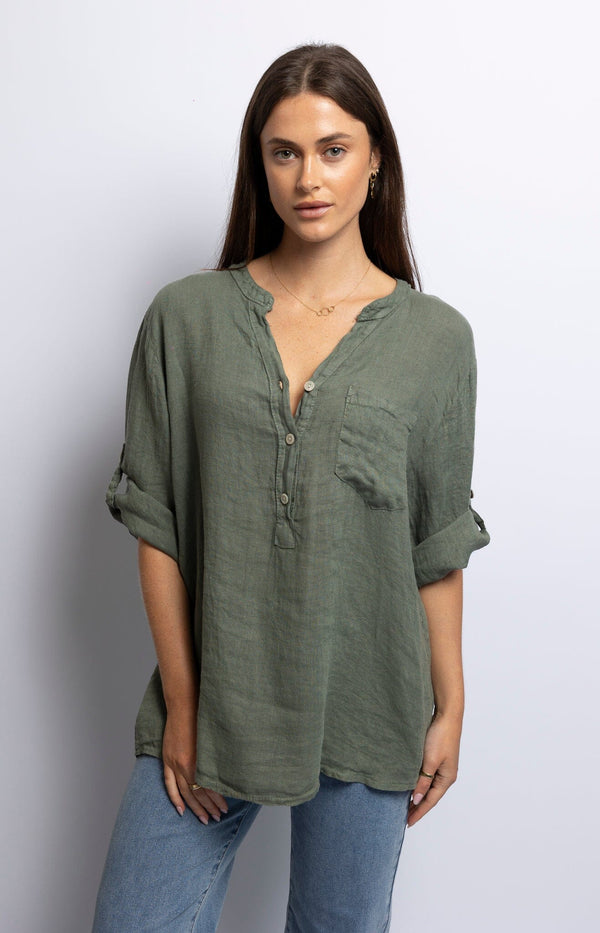 Olive green linen blouse with V-neck, short sleeves, button front, and pocket detail – Breezy style Volange Paris.