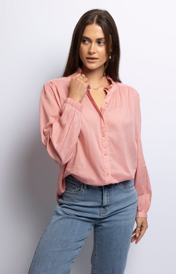 Soft pink cotton blouse with V-neck, puffed long sleeves, and button detailing – French elegance from Volange Paris.