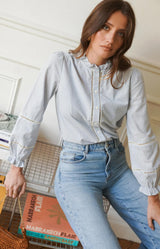 Blue striped cotton blouse with frill neckline, ladder trim details and long sleeves – Volange Paris, Parisian fashion in Sydney (Mosman, Paddington and Bronte) or Australia-wide online.