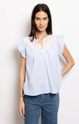 Light blue striped blouse with lace neckline and flutter sleeves – Parisian elegance by Volange Paris.