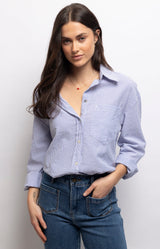 Blue and white striped cotton shirt with a relaxed fit, classic collar, chest pocket and buttoned cuffs. 100% cotton – Volange Paris, Parisian fashion in Sydney (Mosman, Paddington and Bronte) or Australia-wide online.