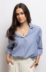 Blue and white striped shirt with a classic collar, relaxed straight fit and soft-touch fabric for effortless everyday style – Volange Paris, Parisian fashion in Sydney (Mosman, Paddington and Bronte) or Australia-wide online.
