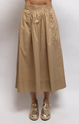 Camel cotton midi skirt with a full A-line silhouette, gathered waist, elasticated back and side pockets – Volange Paris, Parisian fashion in Sydney (Mosman, Paddington and Bronte) or Australia-wide online.