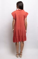 Coral cotton dress with textured waffle fabric, a ruffled neckline, flutter sleeves and flounced hem – Volange Paris, Parisian fashion in Sydney (Mosman, Paddington and Bronte) or Australia-wide online.