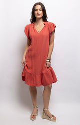 Coral cotton dress with textured waffle fabric, a ruffled neckline, flutter sleeves and flounced hem – Volange Paris, Parisian fashion in Sydney (Mosman, Paddington and Bronte) or Australia-wide online.