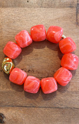 Coral resin bead bracelet with sculptural gold accent – Parisian elegance by Volange Paris, French fashion accessories in Sydney (Mosman, Paddington and Bronte) or Australia-wide online.