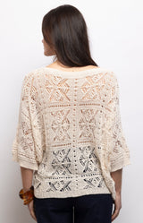 Cream crochet top with intricate openwork detailing, a relaxed fit and three-quarter sleeves – Volange Paris, Parisian fashion in Sydney (Mosman, Paddington and Bronte) or Australia-wide online.