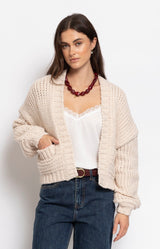 Cream cropped chunky knit cardigan with a relaxed silhouette, patch pockets and cosy texture for effortless layering – Volange Paris, Parisian fashion in Sydney (Mosman, Paddington and Bronte) or Australia-wide online.