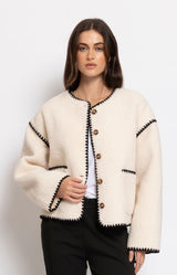Soft cream teddy jacket with a relaxed silhouette, button-front closure and cosy textured finish for effortless winter layering – Volange Paris, Parisian fashion in Sydney (Mosman, Paddington and Bronte) or Australia-wide online.