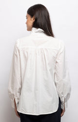 Crisp white blouse in 100% cotton with an elegant stand-up collar, button-down front and relaxed fit – Volange Paris, Parisian fashion in Sydney (Mosman, Paddington and Bronte) or Australia-wide online.