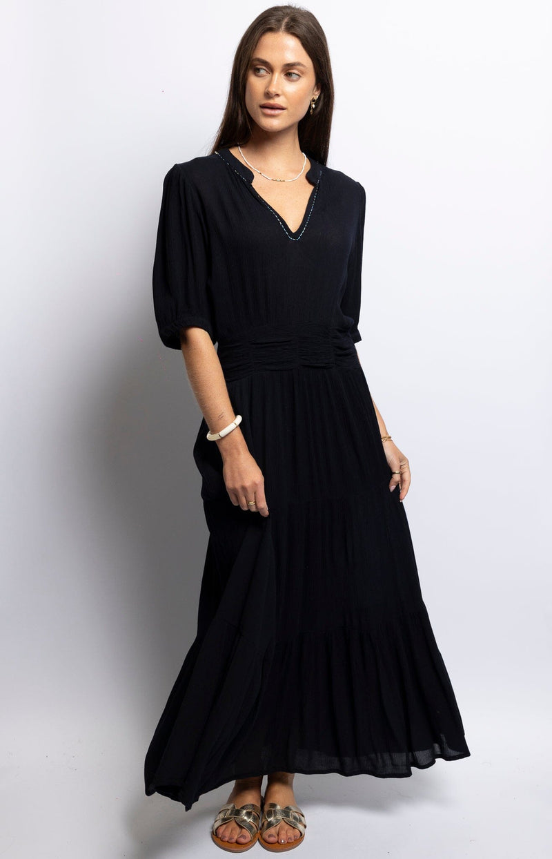 Dark navy long summer dress with v-neck, pleated waist and tiered skirt – Parisian style by Volange Paris.
