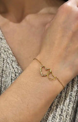 Double heart gold bracelet with delicate crystal details and fine chain – elegant French jewellery by Volange Paris, available in Sydney (Mosman, Paddington and Bronte) or Australia-wide online.