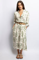Cream floral print midi dress with V-neck, long sleeves, button front, and belted waist – Bohemian chic Volange Collections French Fashion