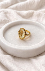 Gold ring with oval translucent stone and eye motif detail, Parisian elegance by Volange Paris, French fashion in Sydney