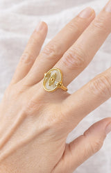 Gold ring with oval translucent stone and eye motif detail, Parisian elegance by Volange Paris, French fashion in Sydney