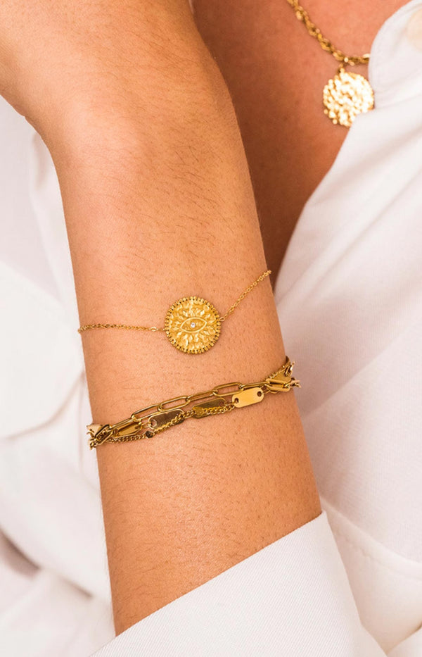 Gold bracelet with engraved eye medallion and crystal detail - Parisian elegance by Volange Paris 
