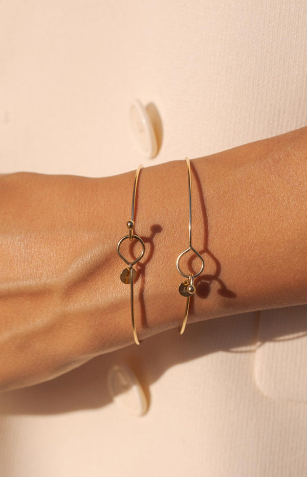 Gold bangle with hook clasp and charm – French jewellery by Volange Paris.
