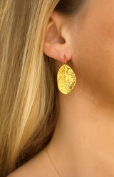 Gold-plated textured leaf earrings with hook design – Elegant French jewellery from Volange Paris