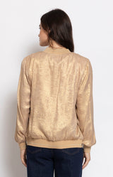 Gold metallic bomber jacket with a subtle shimmer, relaxed fit and zip-front design for effortless day-to-evening style – Volange Paris, Parisian fashion in Sydney (Mosman, Paddington and Bronte) or Australia-wide online.