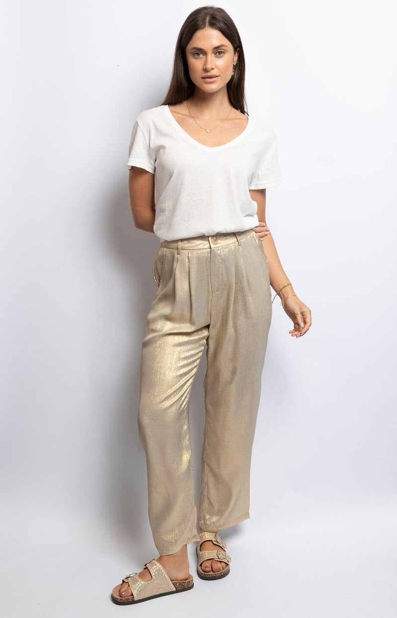 Shimmering gold polyester tapered pants with pleated front, elastic waist, and button closure – Luxe Parisian sparkle by Volange Paris.