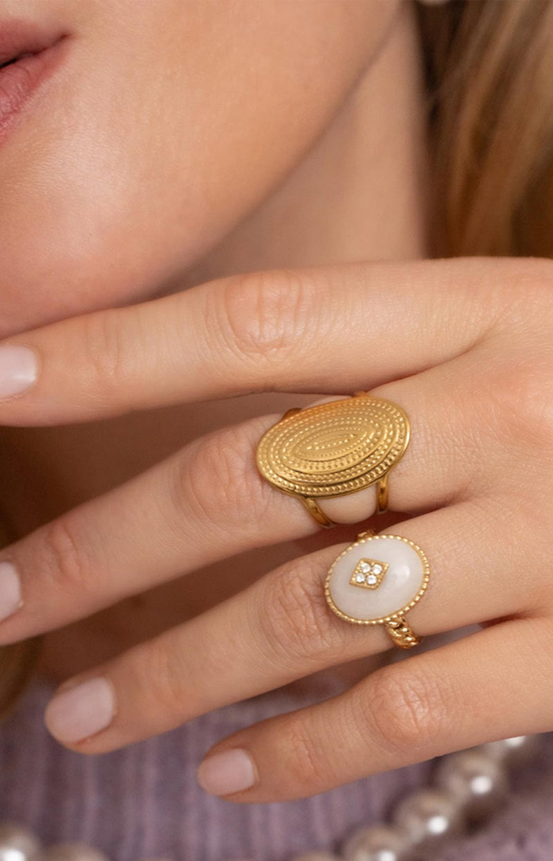 Gold oval medallion ring with engraved detail and adjustable fit Parisian jewellery by Volange Paris.