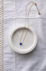 Gold-plated necklace with a blue faceted bead pendant – Volange Paris, Parisian jewellery in Sydney and Australia-wide online.
