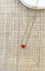 Gold-tone stainless steel necklace with a red clover pendant, fine adjustable chain and water-resistant non-tarnish finish – Volange Paris, Parisian fashion in Sydney (Mosman, Paddington and Bronte) or Australia-wide online.
