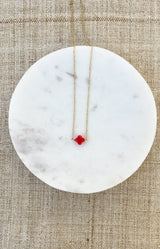 Gold-tone stainless steel necklace with a red clover pendant, fine adjustable chain and water-resistant non-tarnish finish – Volange Paris, Parisian fashion in Sydney (Mosman, Paddington and Bronte) or Australia-wide online.
