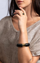 Gold-tone adjustable ring with a faceted black stone, open double-band design and delicate textured detailing – Volange Paris, Parisian fashion in Sydney (Mosman, Paddington and Bronte) or Australia-wide online.
