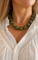 Green bead statement necklace with glossy olive resin beads and gold-tone details – Parisian jewellery by Volange Paris, available in Sydney (Mosman, Paddington and Bronte) or Australia-wide online.