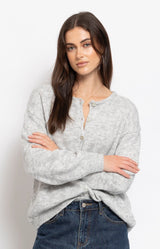 Soft light grey cardigan in a cosy fluffy knit with a relaxed silhouette and delicate button-front detail – Volange Paris, Parisian fashion in Sydney (Mosman, Paddington and Bronte) or Australia-wide online.