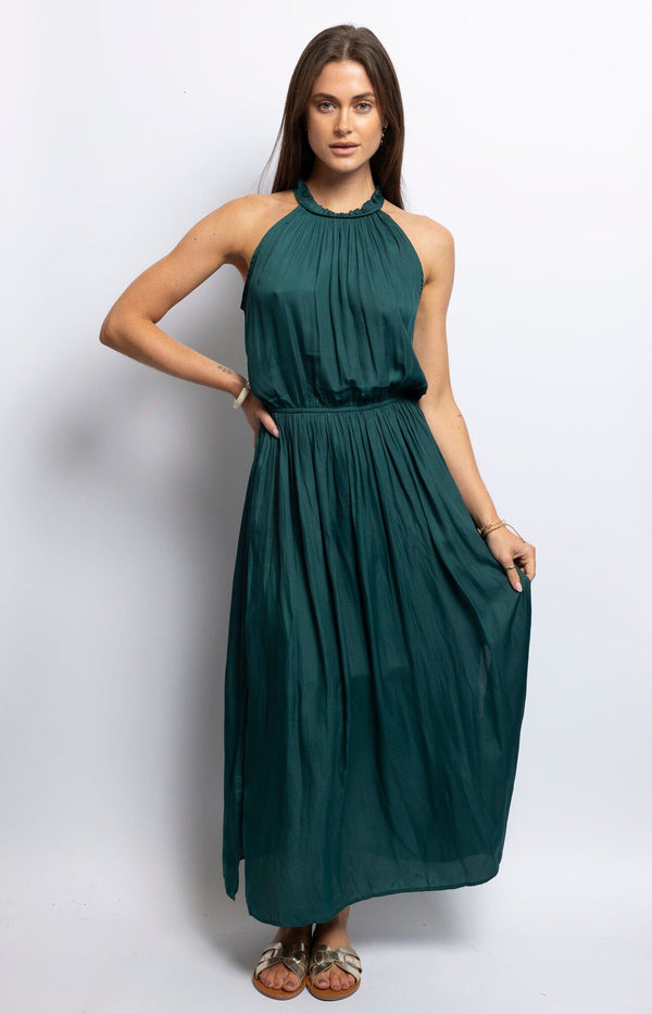 Green halter-neck maxi dress with pleated bodice and flowy skirt – Modern French style by Volange Paris.