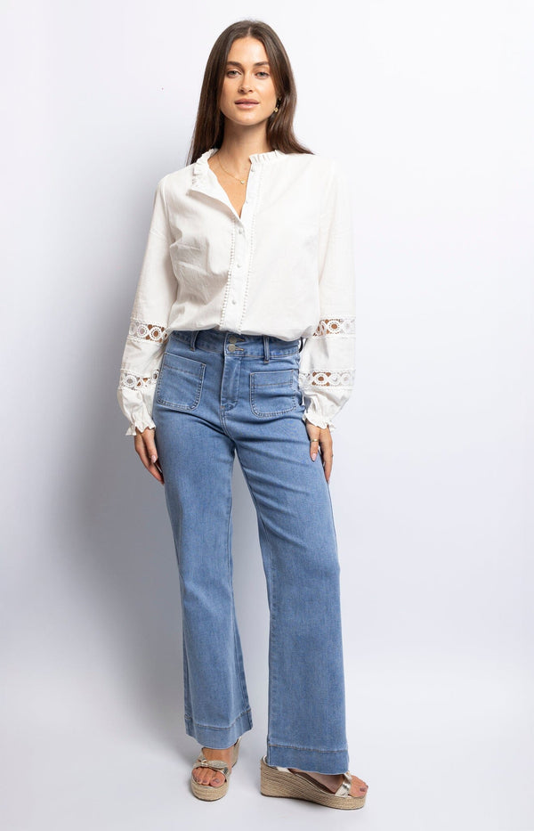 High-waisted wide-leg denim jeans with front patch pockets, light blue wash, and relaxed fit – Volange Paris, French fashion.