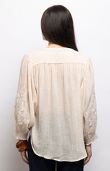 Ivory lightweight voile blouse with tonal embroidered sleeves, flattering V-neck and relaxed fit – Volange Paris, Parisian fashion in Sydney (Mosman, Paddington and Bronte) or Australia-wide online.